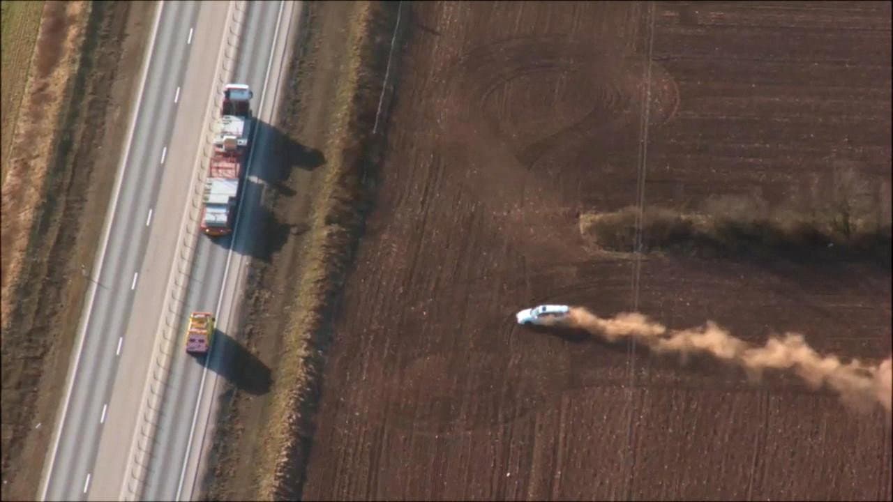 Car chase in a field
